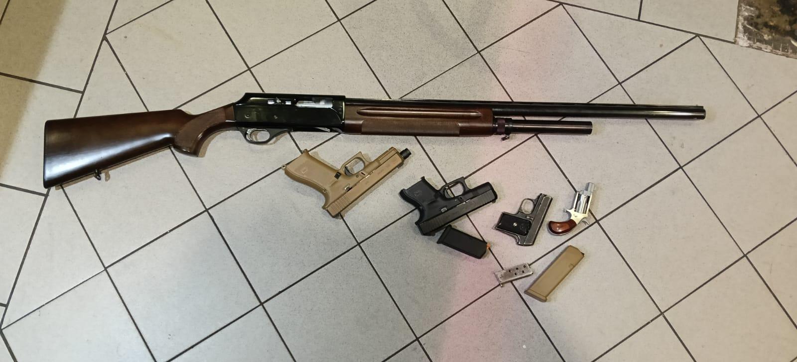Recovered firearms including shotgun and handguns